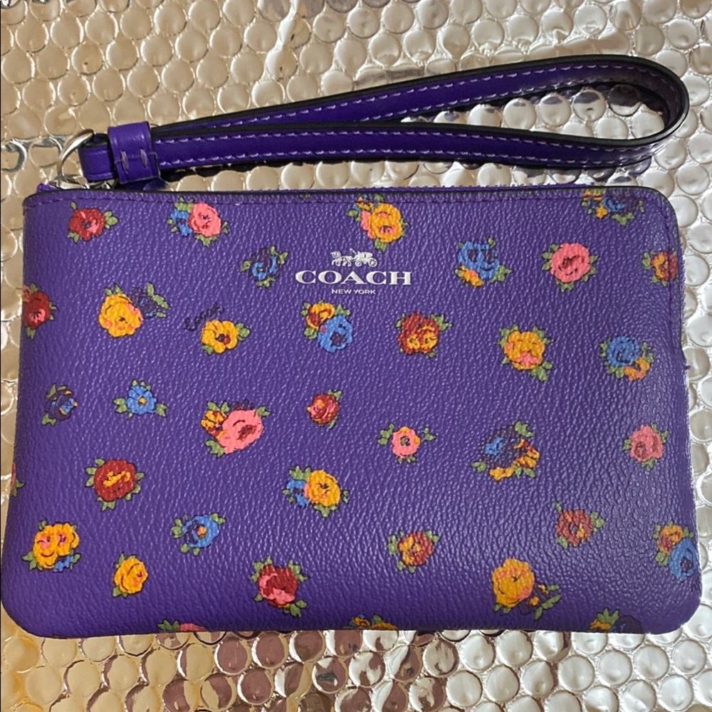 Coach Purple Floral Wristlet.   6950